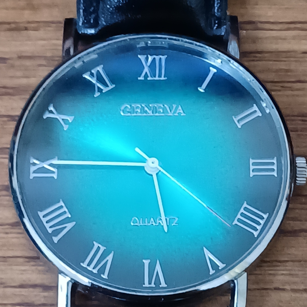 Men's black and green watch